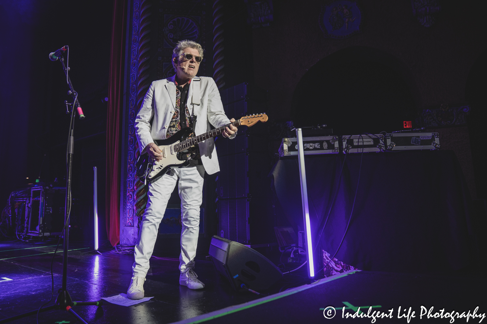 Tom Bailey of the Thompson Twins playing the guitar while performing "Lay Your Hands on Me" at Uptown Theater in Kansas City, MO on July 7, 2024.