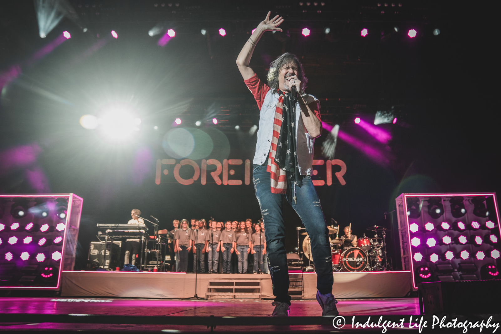 Foreigner lead singer Kelly Hansen singing "I Want to Know What Love Is" with the local children's choir at Azura Amphitheater in Bonner Springs, KS on October 5, 2024.