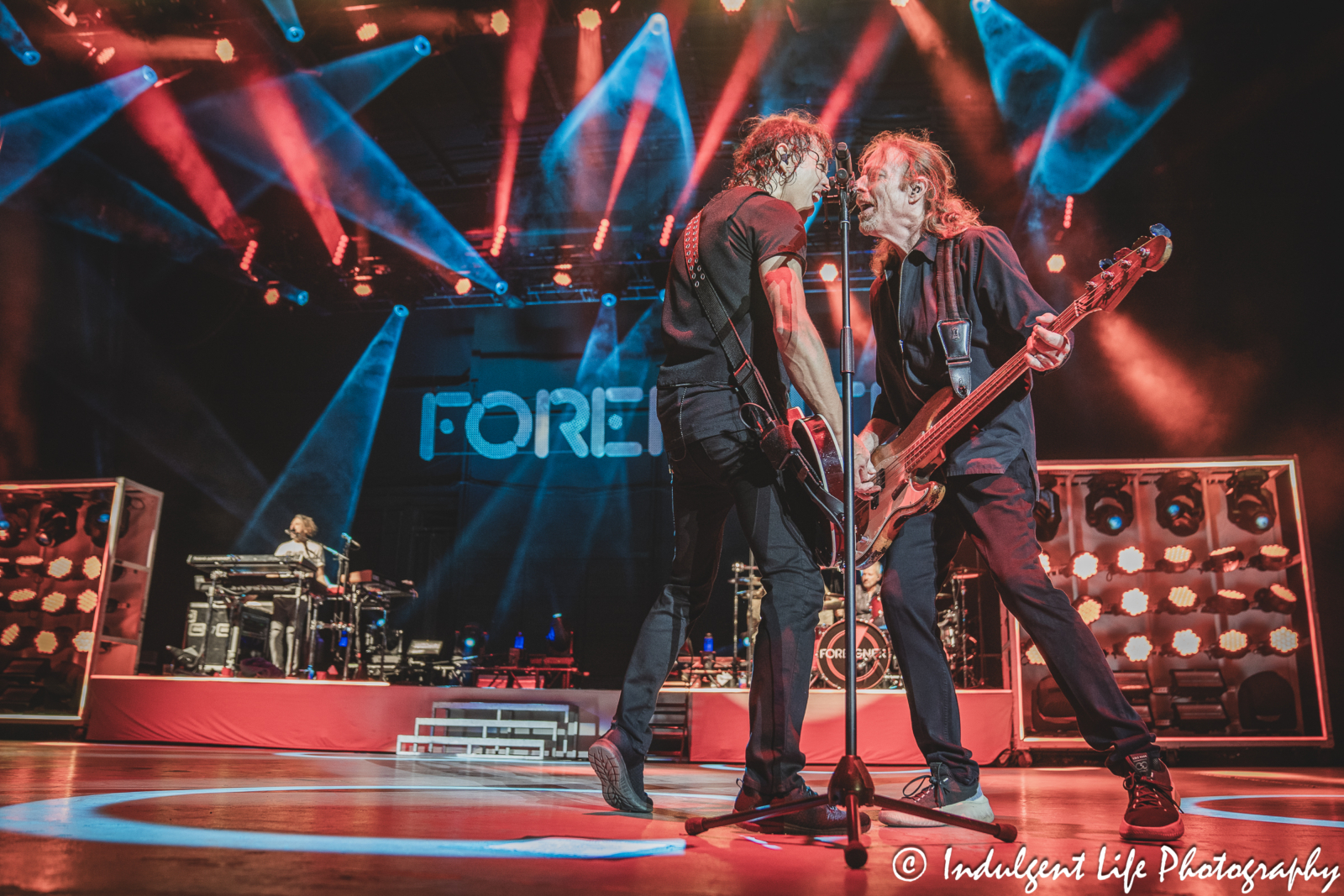 Foreigner bandmates Luis Maldonado and Jeff Pilson performing "Hot Blooded" at Azura Amphitheater in Bonner Springs, KS on October 5, 2024.