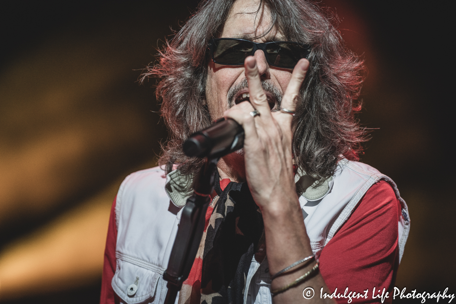 Frontman Kelly Hansen of Foreigner singing "Hot Blooded" live in concert at Azura Amphitheater in Bonner Springs, KS on October 5, 2024.