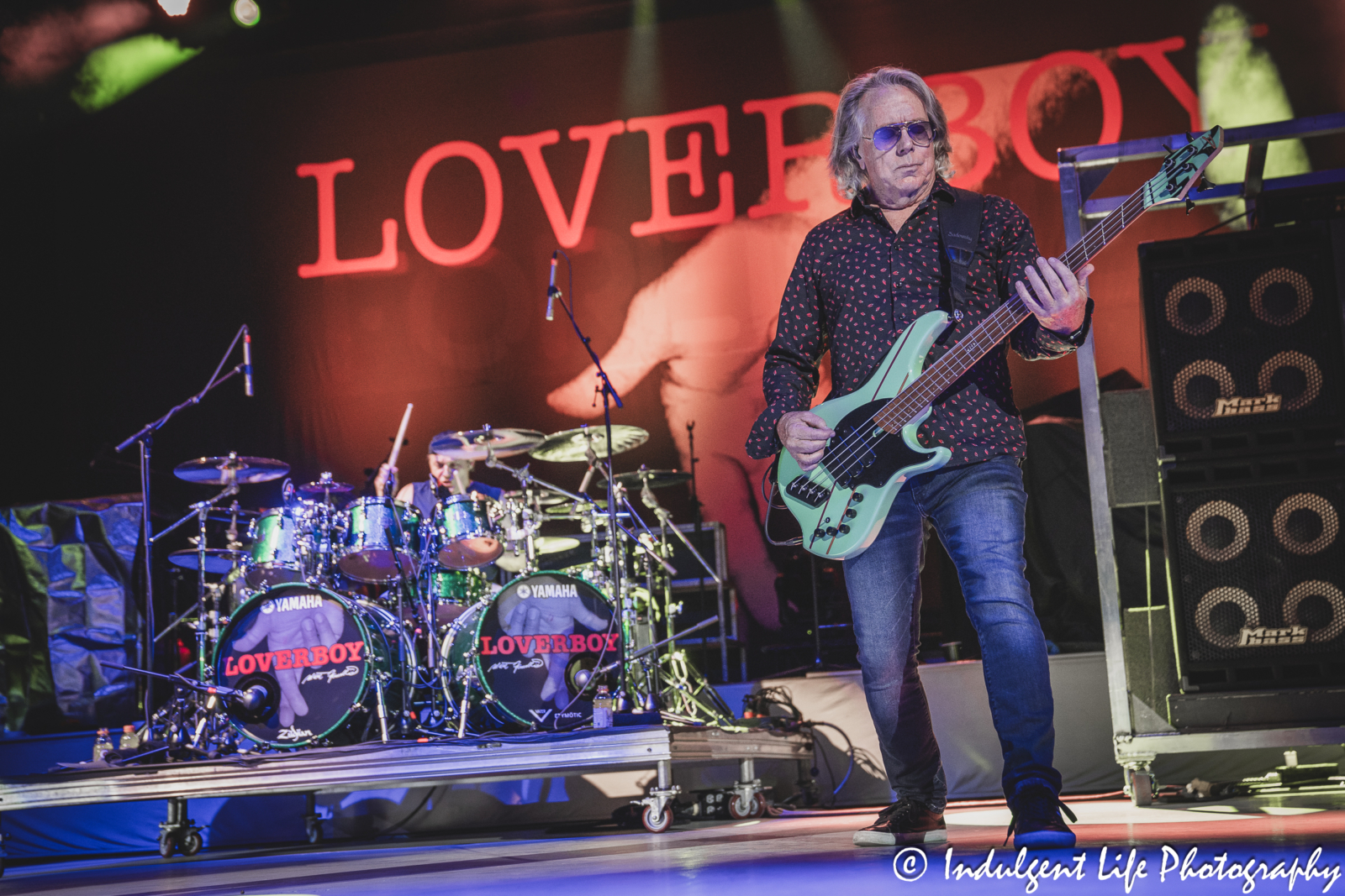 Loverboy bass guitarist Ken "Spider" Sinnaeve and drummer Matt Frenette performing together at Azura Amphitheater in Bonner Springs, KS on October 5, 2024.