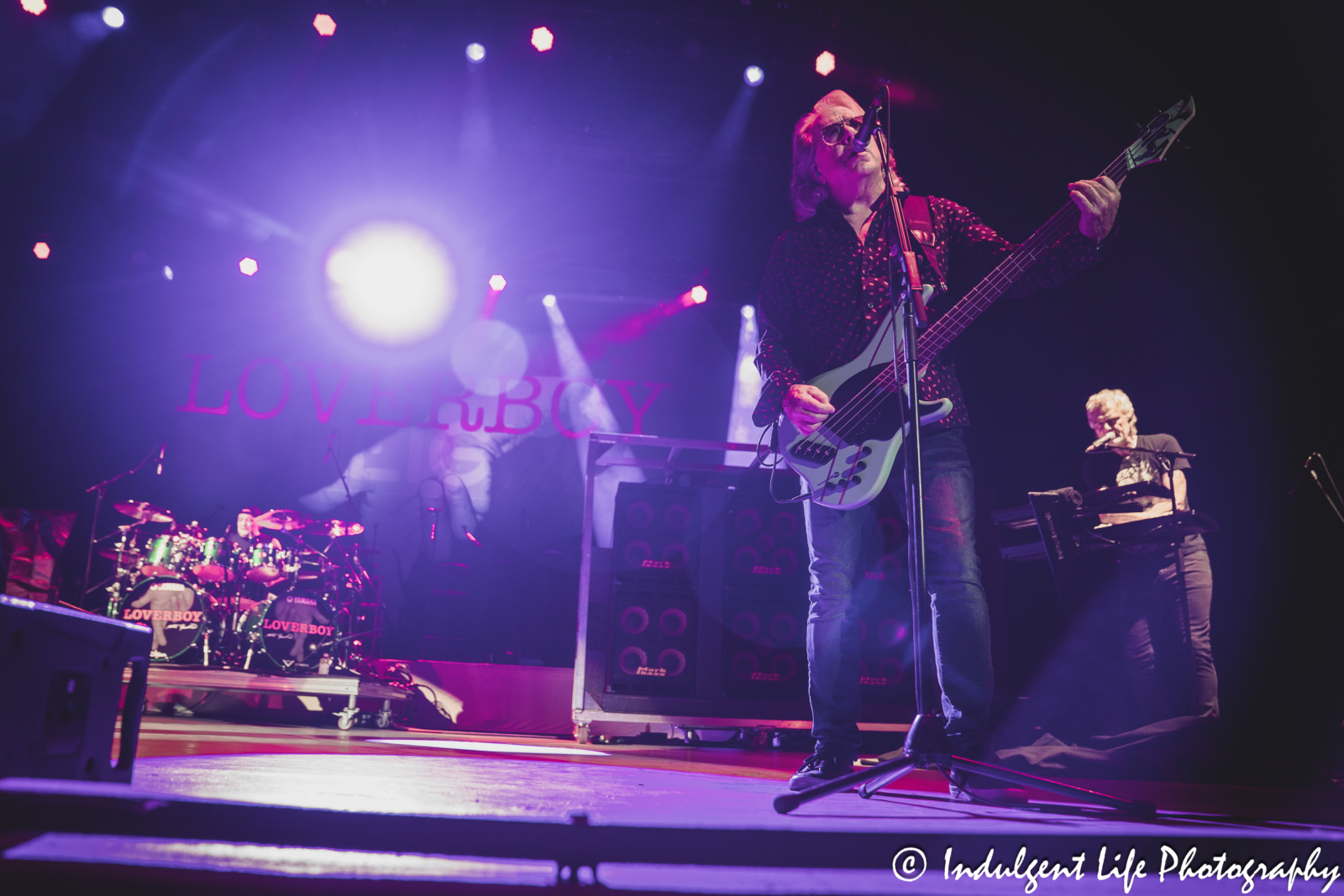 Loverboy bandmates Matt Frenette, Ken Sinnaeve and Doug Johnson performing together at Azura Amphitheater in Bonner Springs, KS on October 5, 2024.