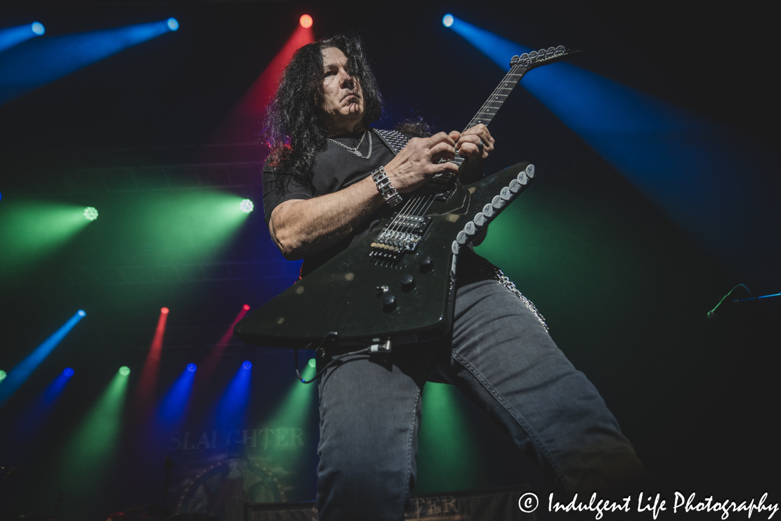 Mark Slaughter playing the guitar live in concert at Ameristar Casino's Star Pavilion in Kansas City, MO on October 19, 2024.